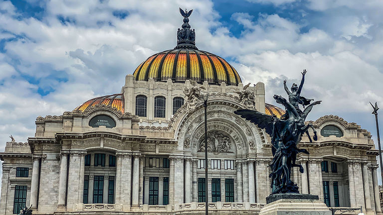 Mexico City is rising in popularity for its vibrant urban life; pictured here is Palacio de Bellas Artes.