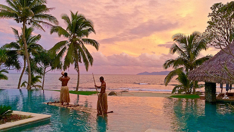 Nanuku’s staff helps guests understand and connect with local culture through moments like this torch lighting ceremony.