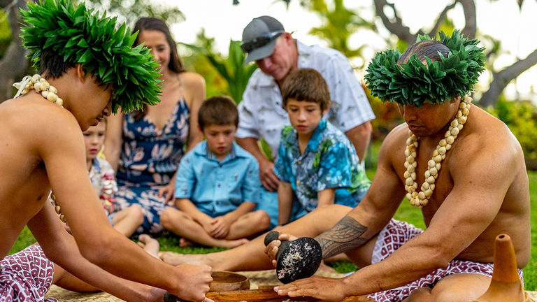 The Feast & Fire Luau, produced by Traditions Hawaii, is offered twice per week and includes a poi pounding demonstration.