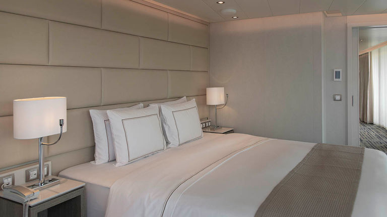 The welcoming Owner’s Suite bedroom features full automation controls.