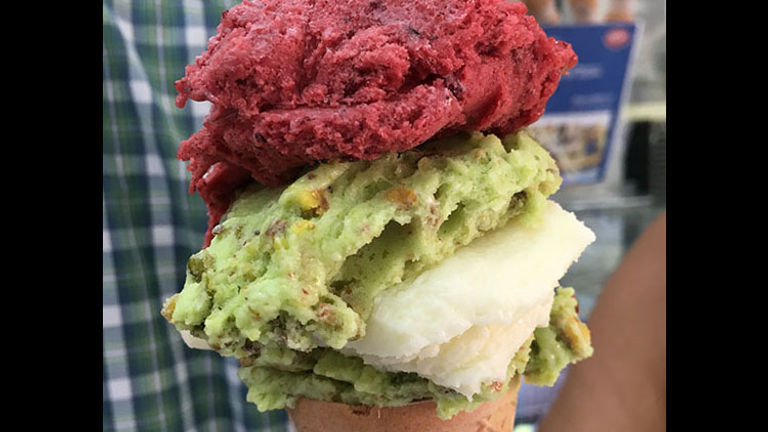 This cone features layers of pistachio, raspberry and ashta ice cream flavors. // © 2017 Giselle Abcarian