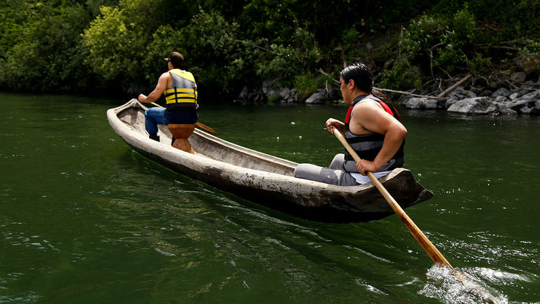 Travelers can take a traditional canoe tour with California’s Yurok people.